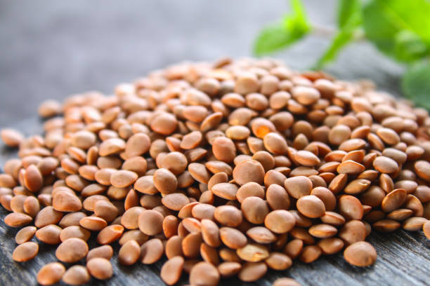 Raw red lentils on a wooden board. Superfood